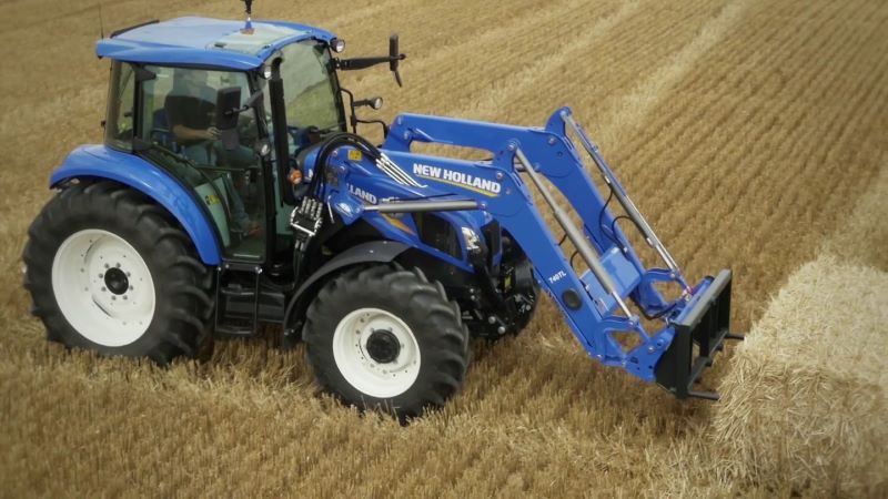 2019 New Holland Ag Tractor Moving Hay Bale