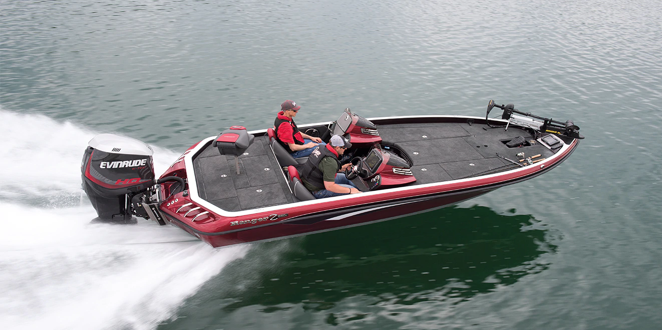 Two guys ripping across the water with an Evinrude outboard motor