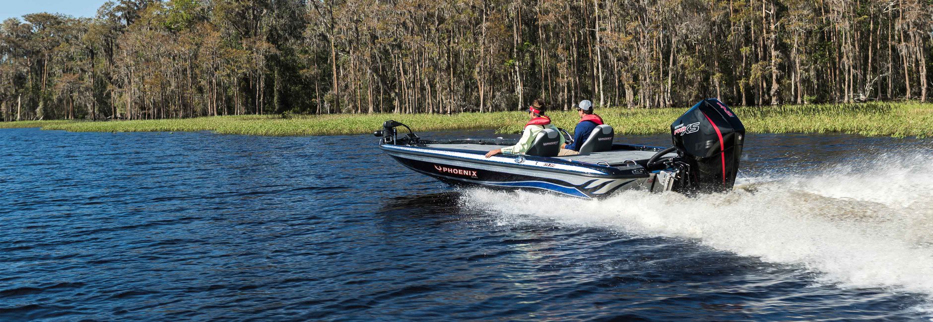 Two guys heading out to do some fishing with the boat powered by a Mercury Marine outboard motor.