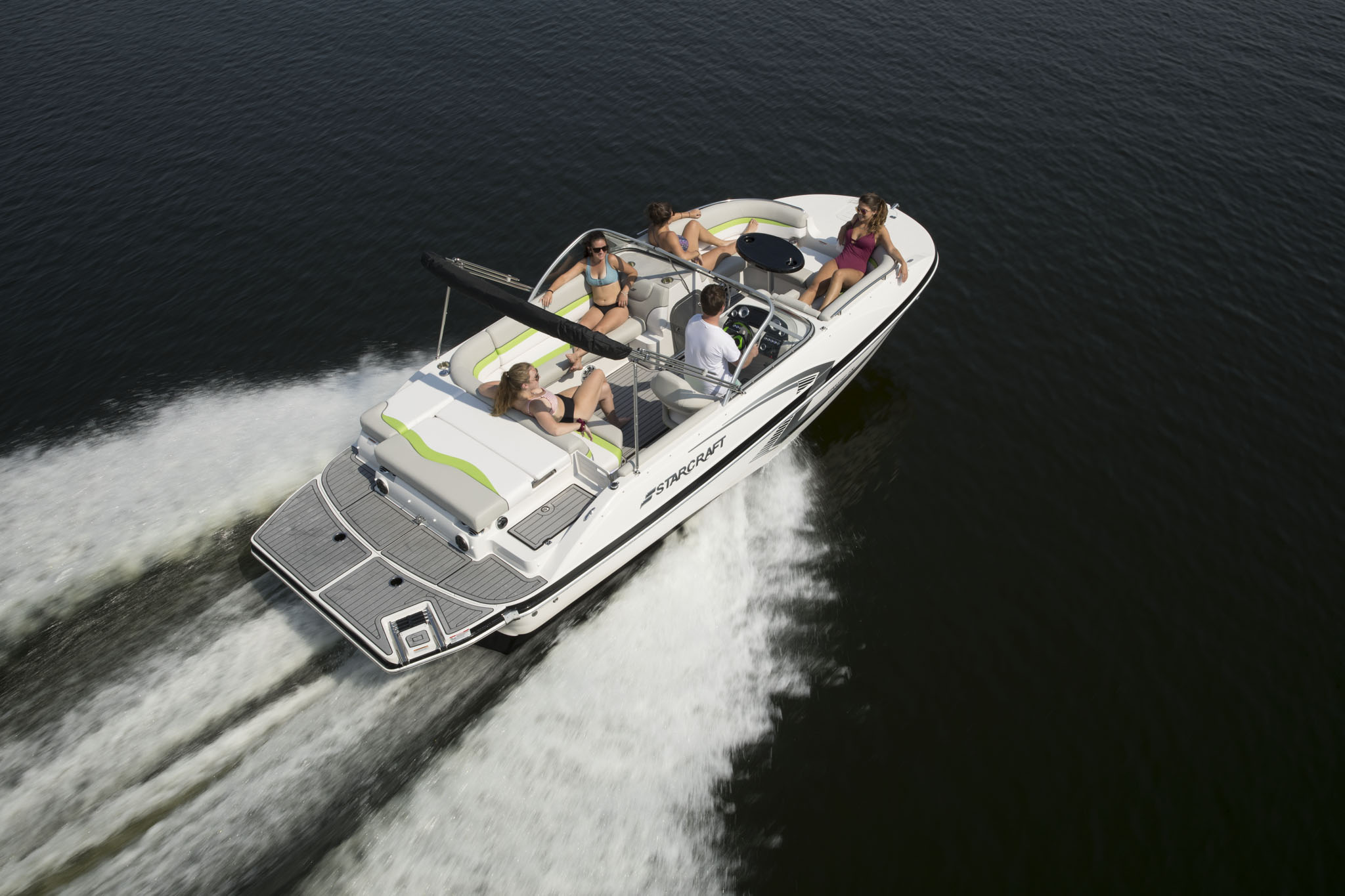 Group of people enjoying a sunny day on the lake with a Starcraft® boat