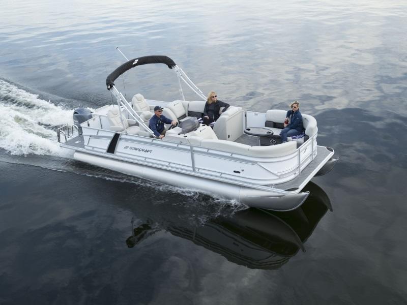 Group of people cruising on a Starcraft® pontoon on the water