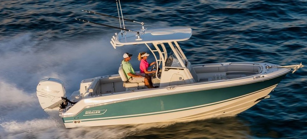 A Couple on a 2020 Boston Whaler® Outrage® boat in the beach 