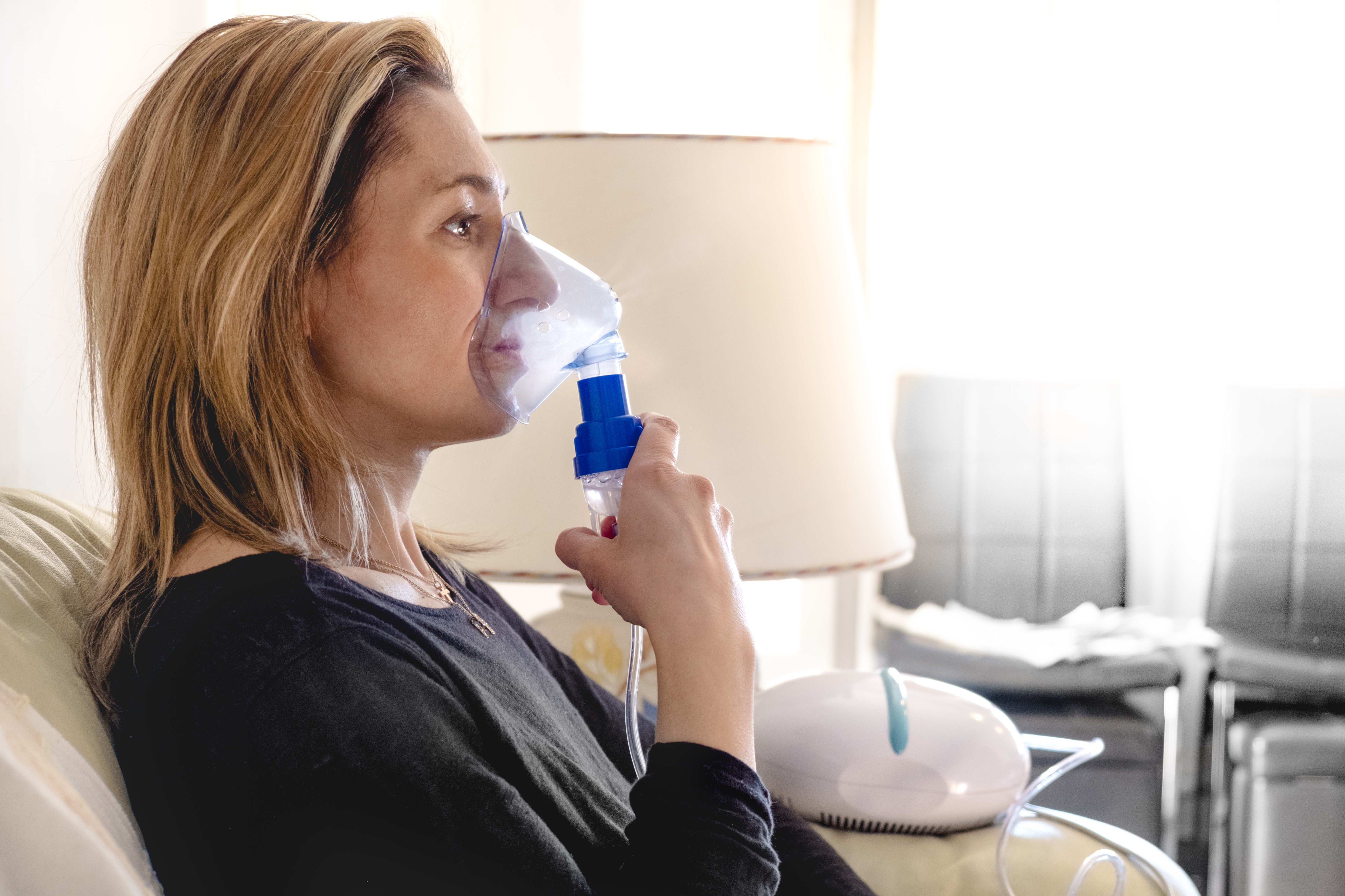 Woman Using A Nebulizer
