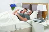 Couple sleeping with CPAP